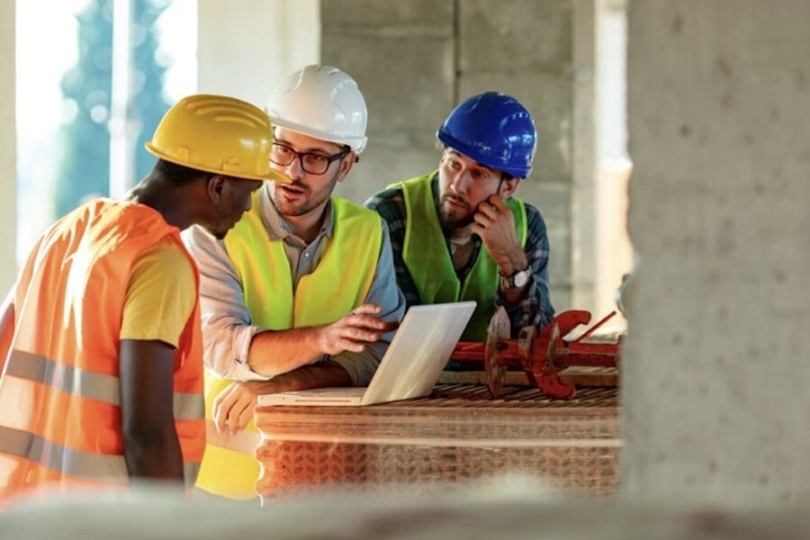 Controlling-Your-Workers-Compensation-Premium-Starts-With-Your-Experience-Modification-Rate-EMR-constrution-men-going-over-plans.